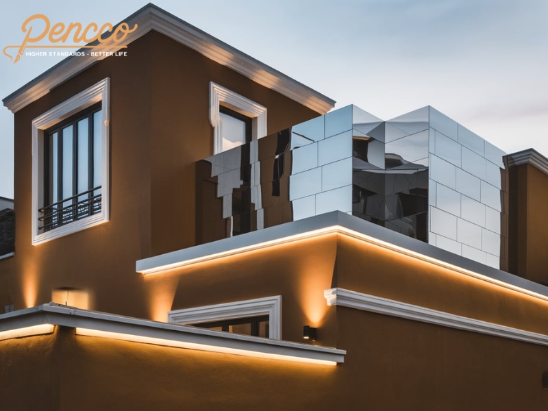 Biệt thự hiện đại với màu sơn vàng nâu đậm và kính phản quang trong thiết kế ngoại thất.